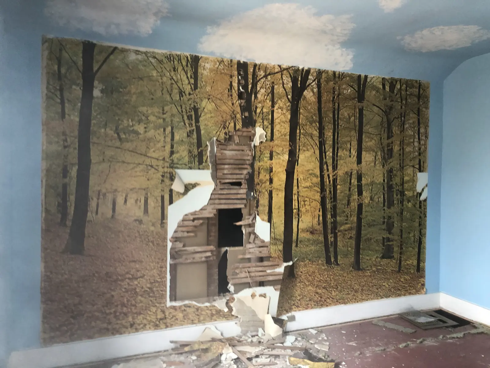 A custom-built rustic doorway and woodland mural feature, an example of Paro Projects' background in creative fabrication